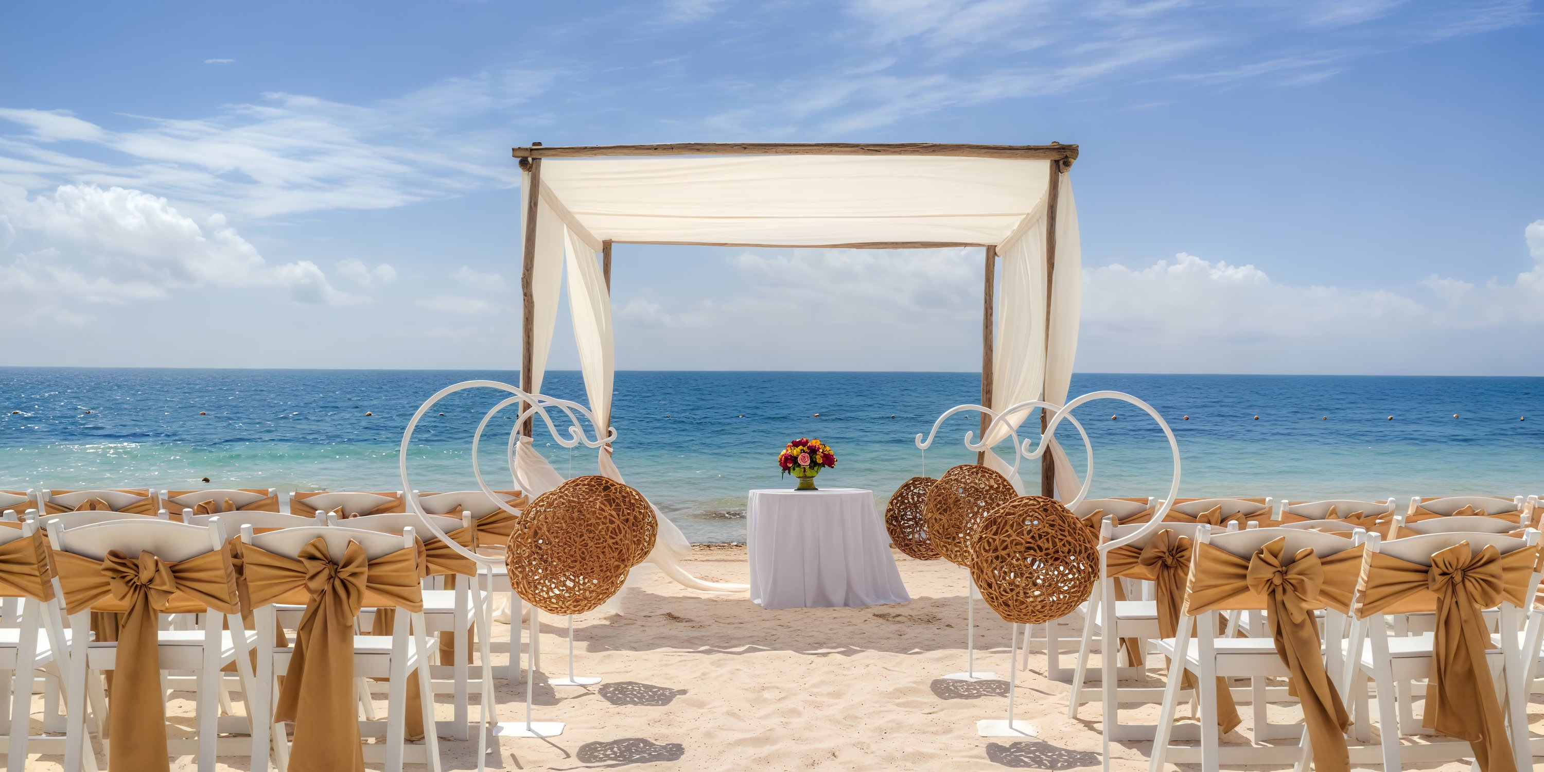 Ocean Coral Spring wedding setup: elegant chairs, a beautiful arch, and a table adorned with flowers all perfectly positioned to face the stunning ocean backdrop for your dream destination wedding.