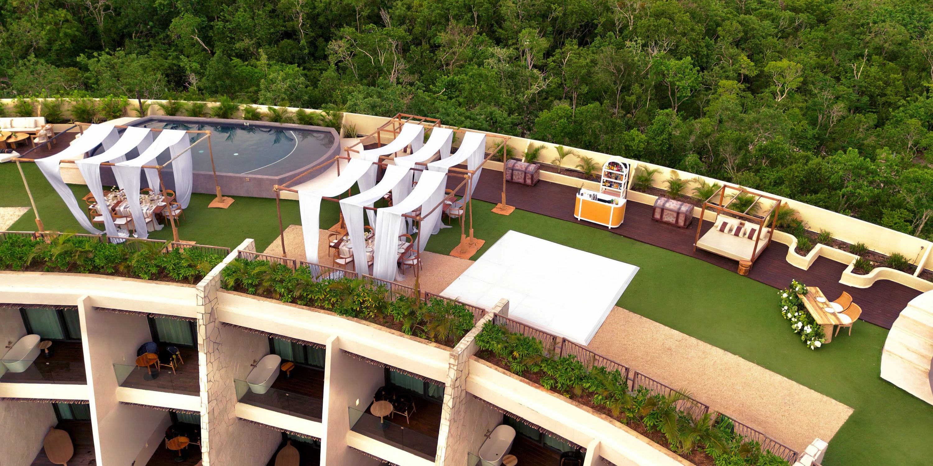 Secrets Tulum&rsquo;s rooftop with cabanas, pool, and forest views is perfect for a destination wedding.