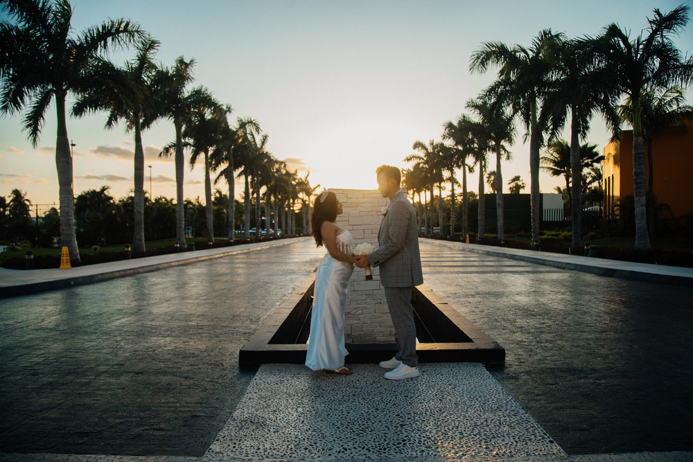 Couple hand in hand at sunset