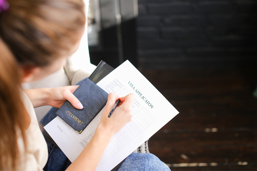 A woman with the documents she needs for her passport renewal