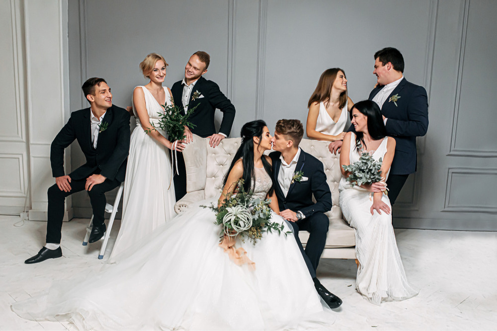 A wedding group posing for a group photo