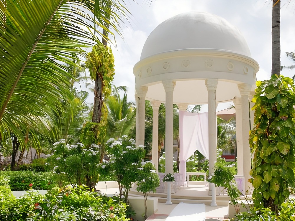Elegant white gazebo with a domed roof—an ideal spot for couples beginning their wedding journey or planning the perfect destination wedding.