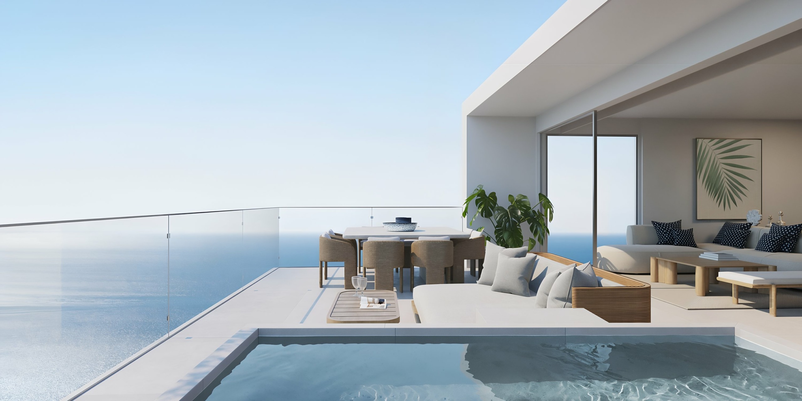 Modern oceanfront terrace with a swimming pool and outdoor lounge area at AVA Resort Cancun.