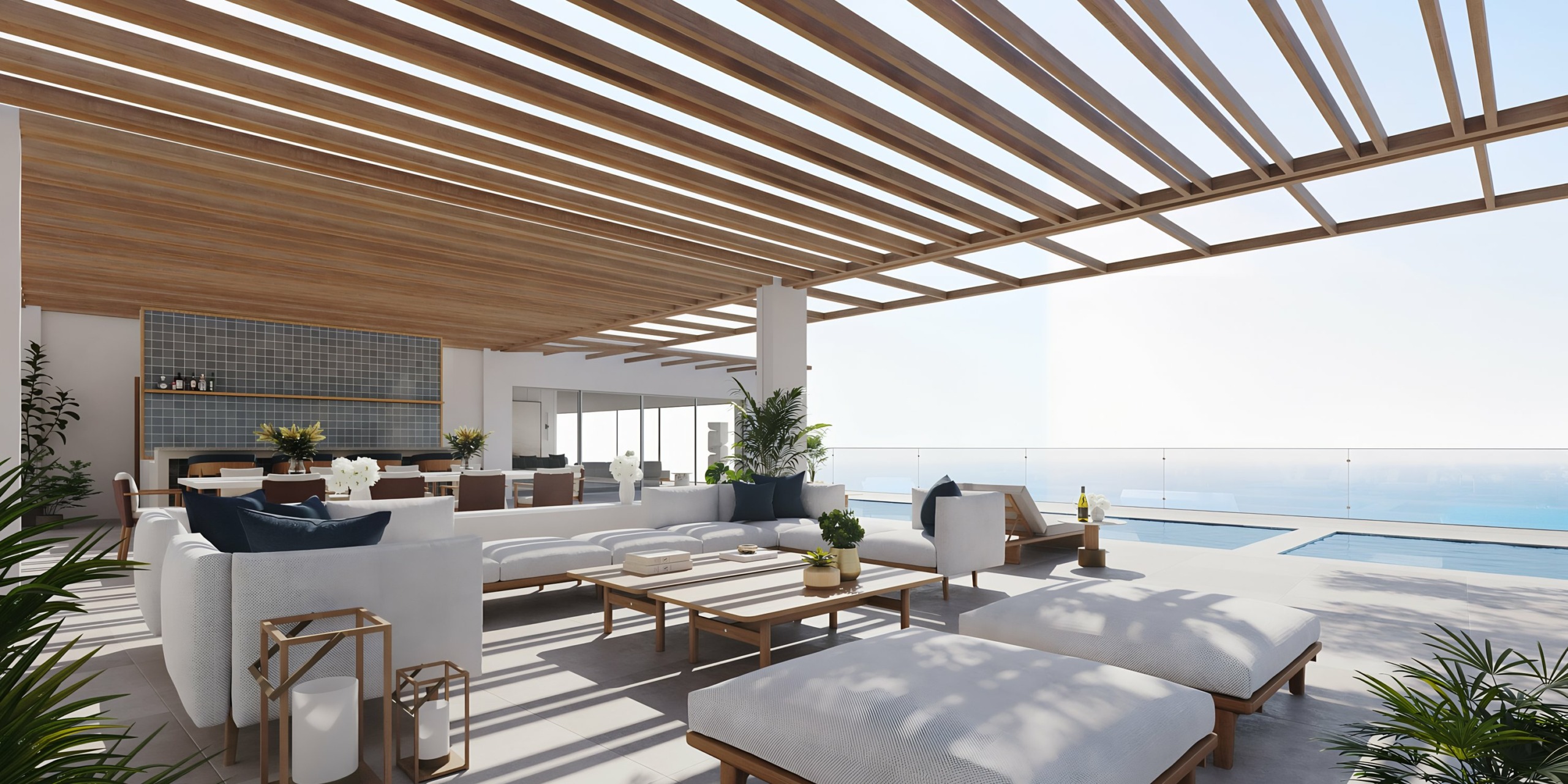 Modern seaside AVA Resort Cancun terrace with infinity pool, open-plan living space, and wooden pergola.