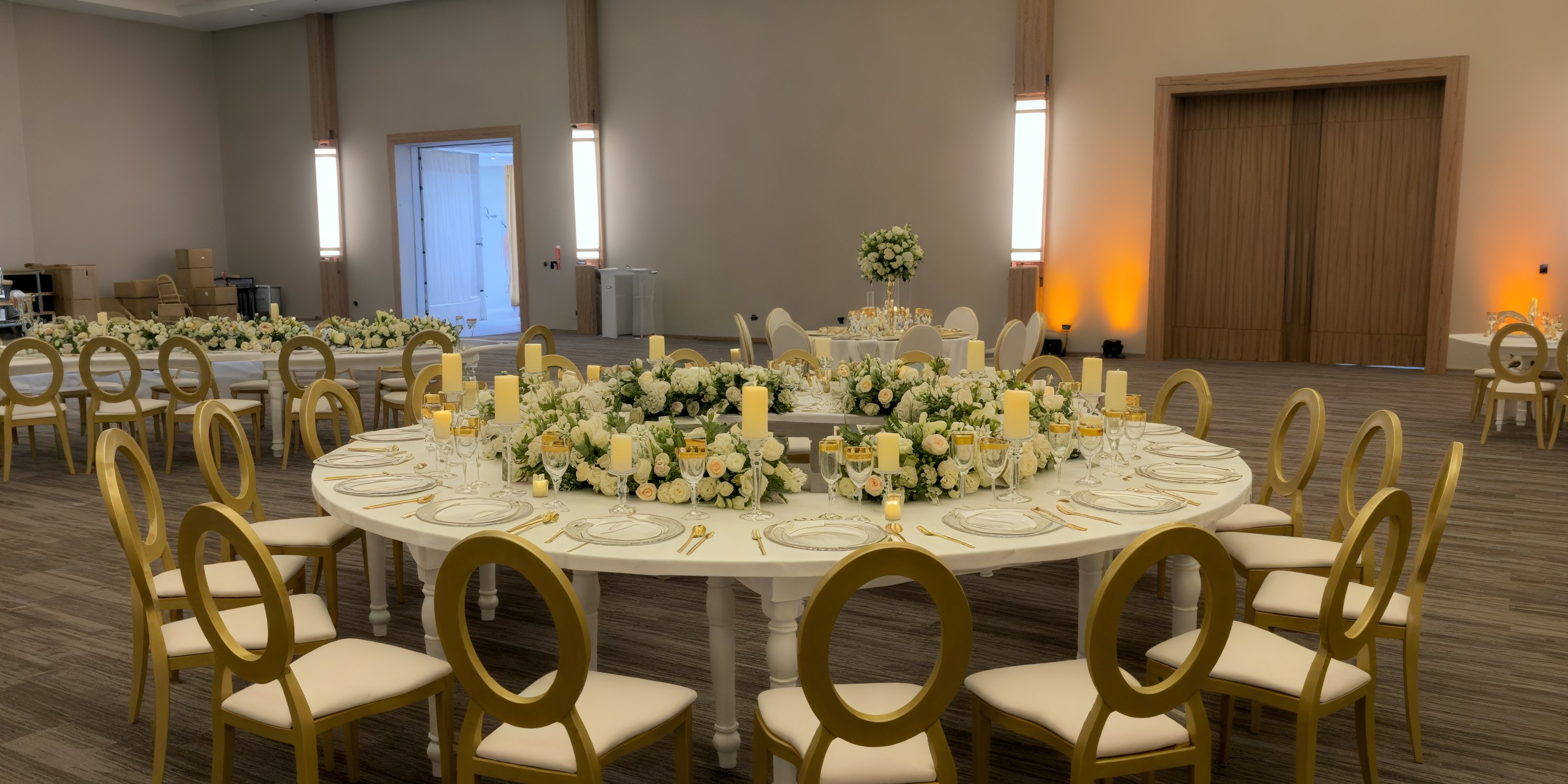 Secrets Tides wedding banquet table decorated with white and yellow florals in an elegant event space.