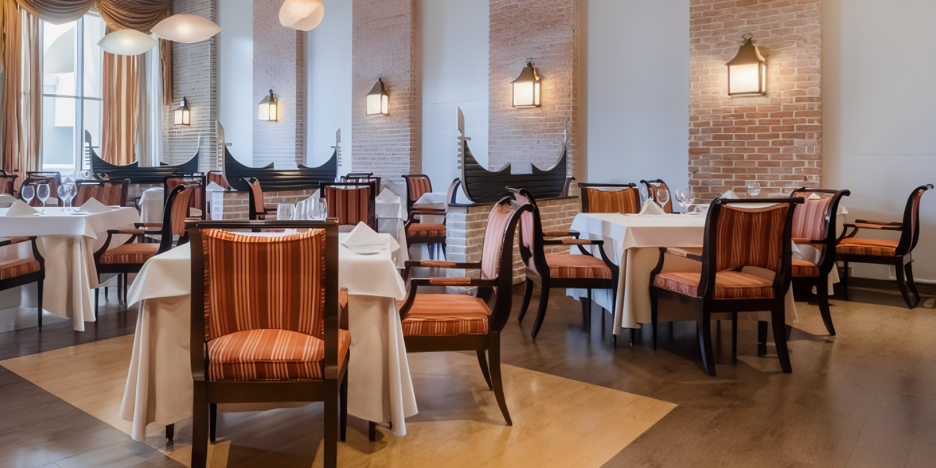 Elegant destination wedding setup at JOIA Rose Hall with striped chairs, white linens, and brick accents.