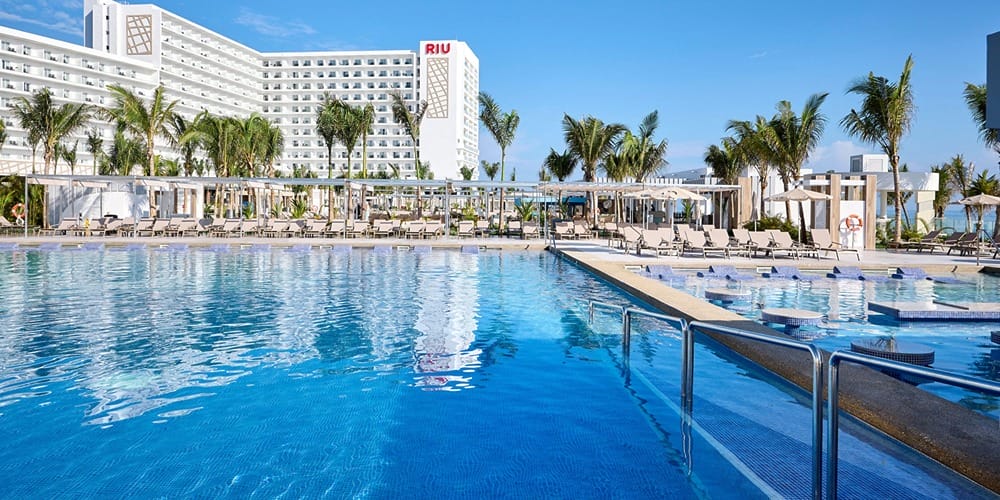 Spacious outdoor pool at a modern hotel, ideal for a destination wedding in Jamaica under $3,000.