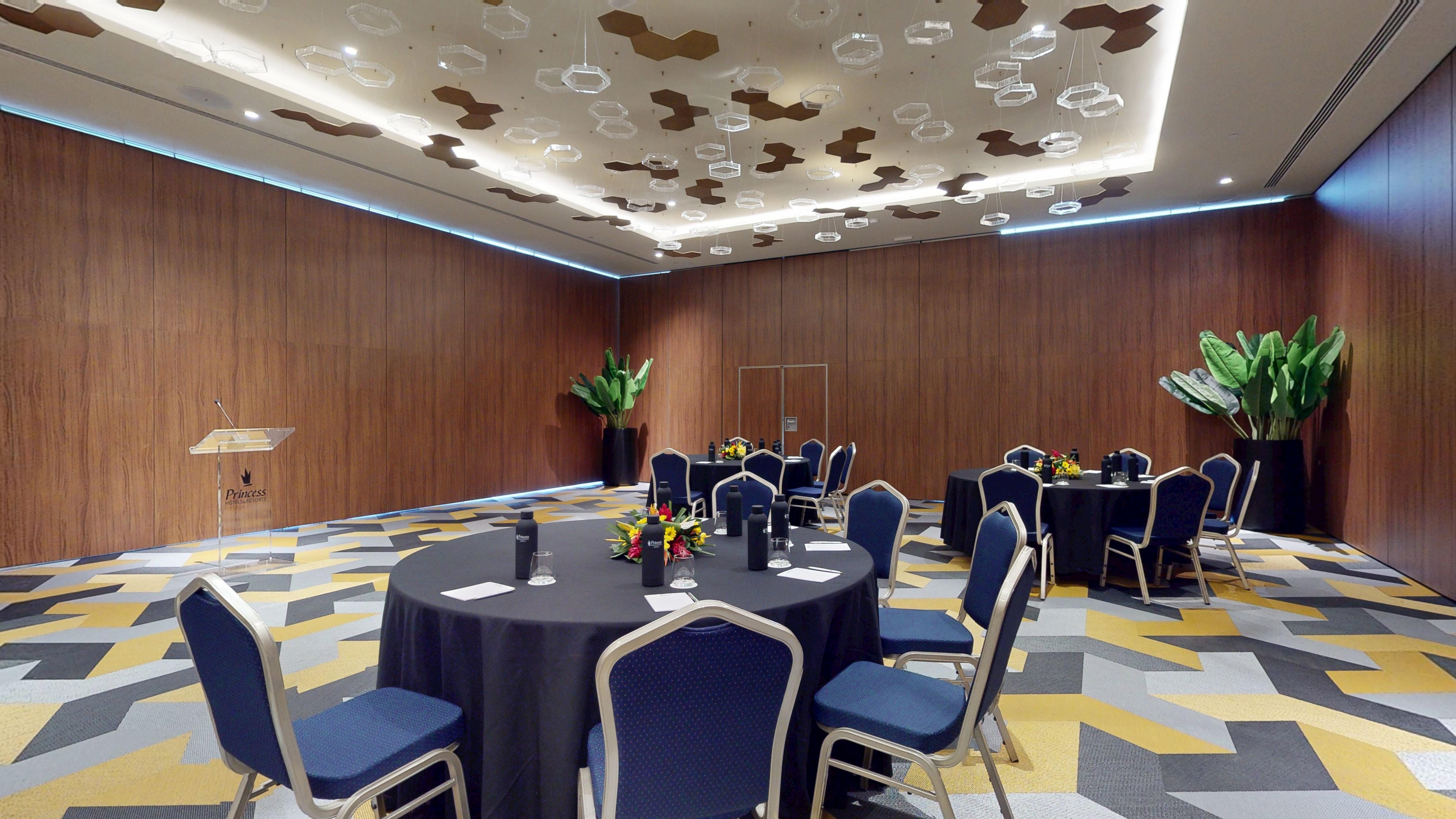 Round tables and chairs set up for a destination wedding at Princess Grand Jamaica.