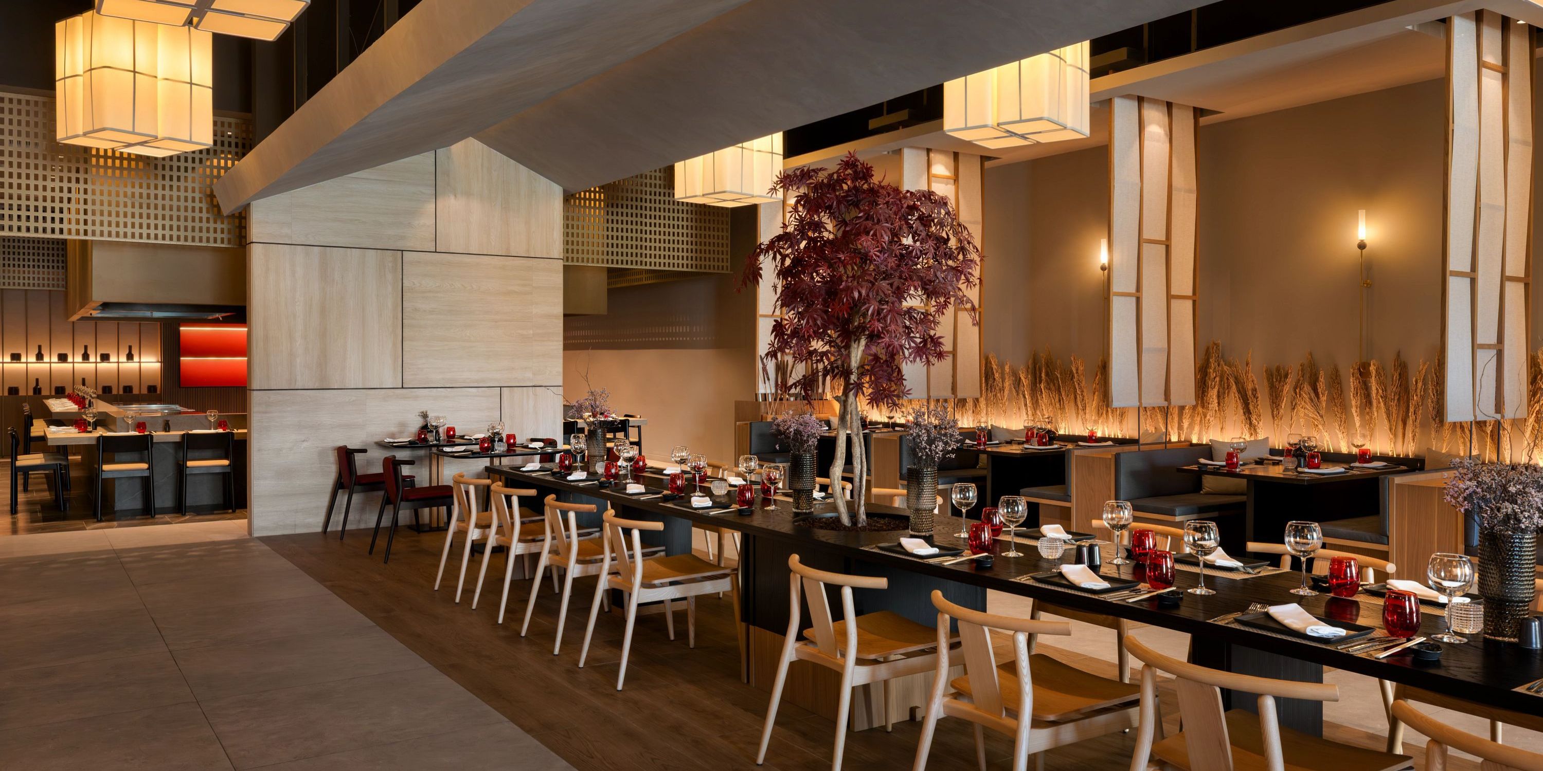 Secrets Baby Beach Aruba is perfect for a wedding, with set tables, wood chairs, and warm lighting.