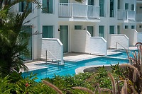Perfect for a destination wedding, Secrets St Lucia features white rooms with balconies and lush pool views.