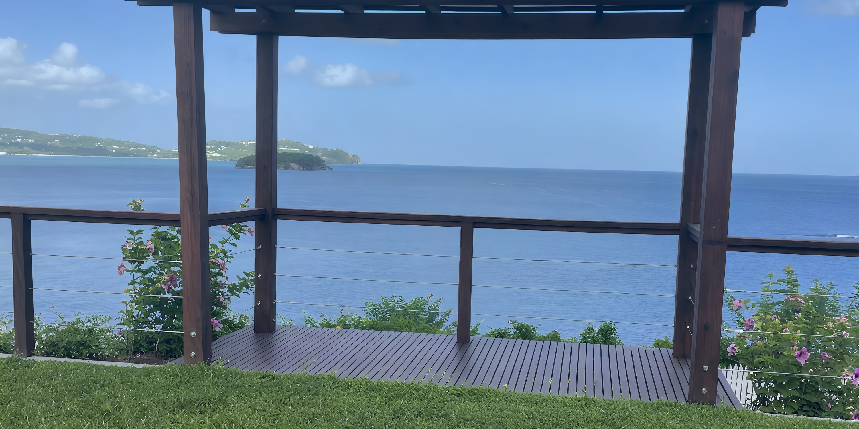 Gazebo at Secrets St Lucia, perfect for a destination wedding, overlooks the sea and distant green hills.