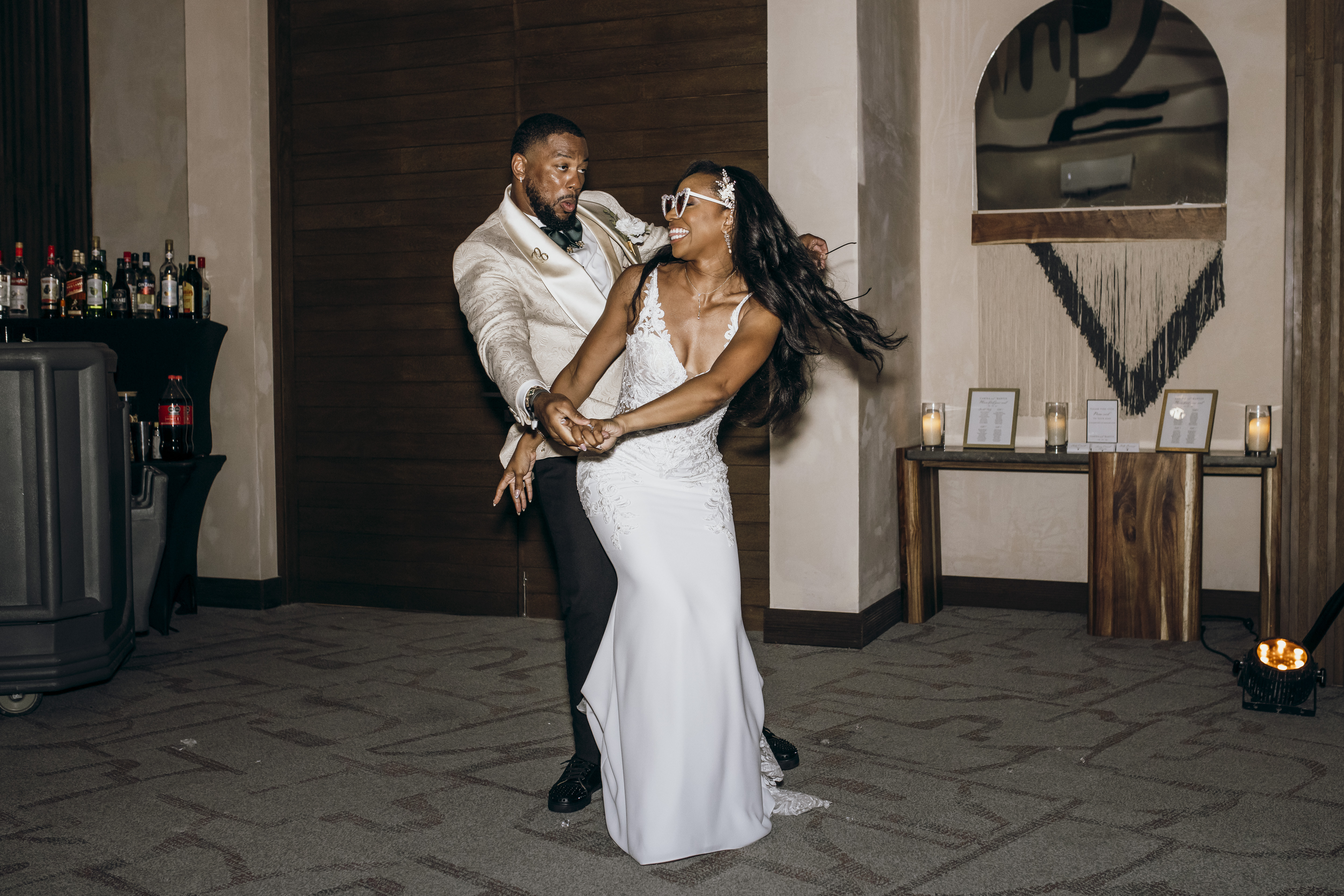 Carina and Marvin share a dance at their indoor destination wedding reception.