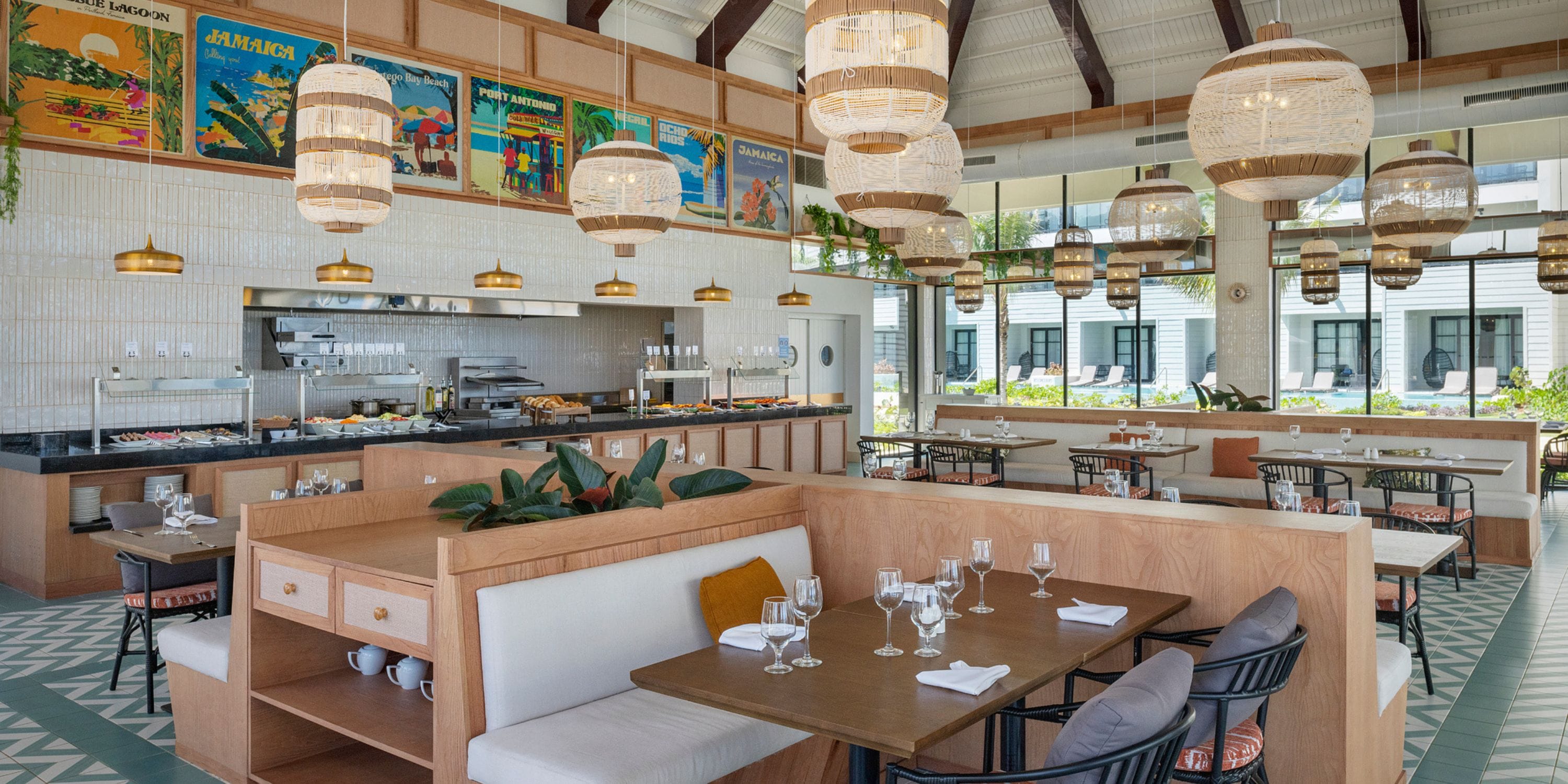Ocean Eden Bay&rsquo;s modern interiors with wooden booths and set tables create a chic destination wedding vibe.