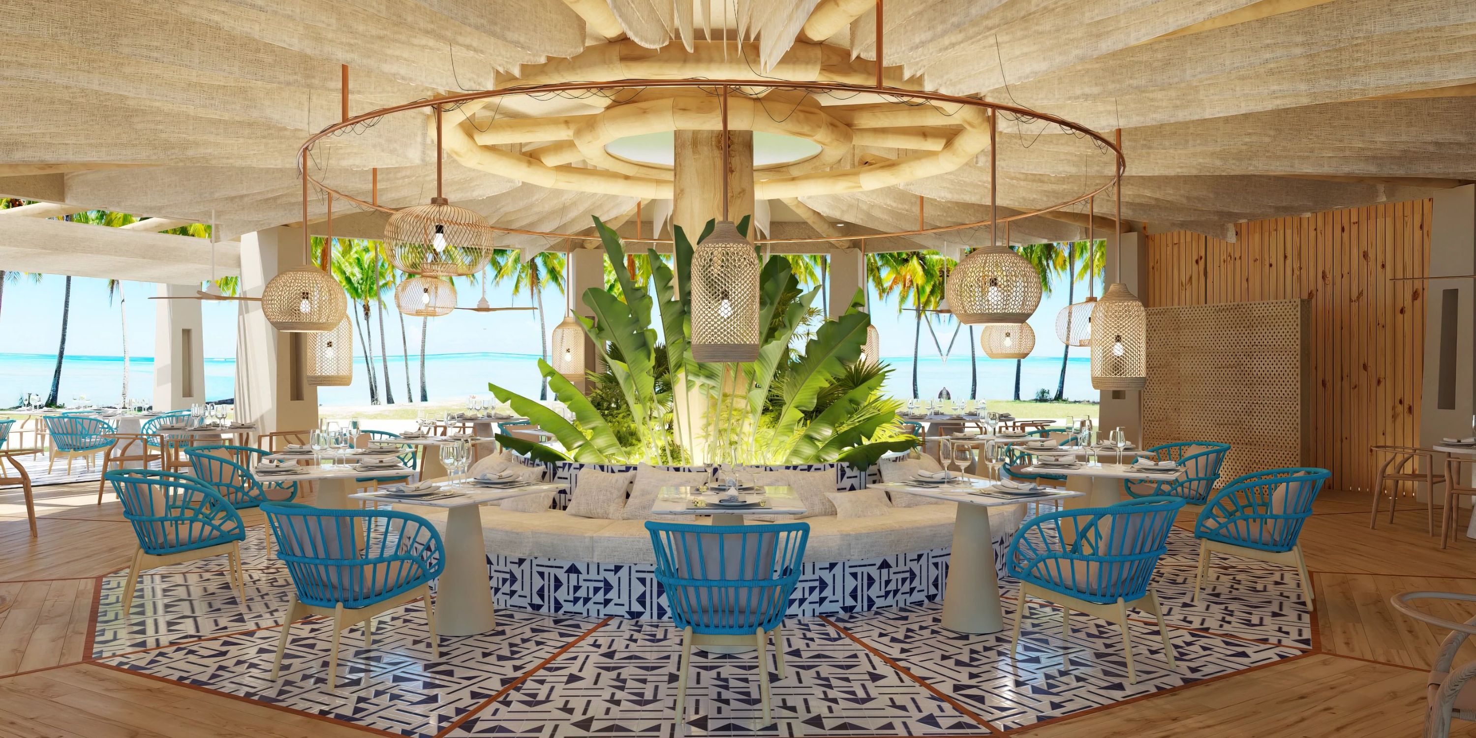 Dreams Playa Esmeralda: stylish destination wedding venue with blue chairs, patterned floor, lush plants.