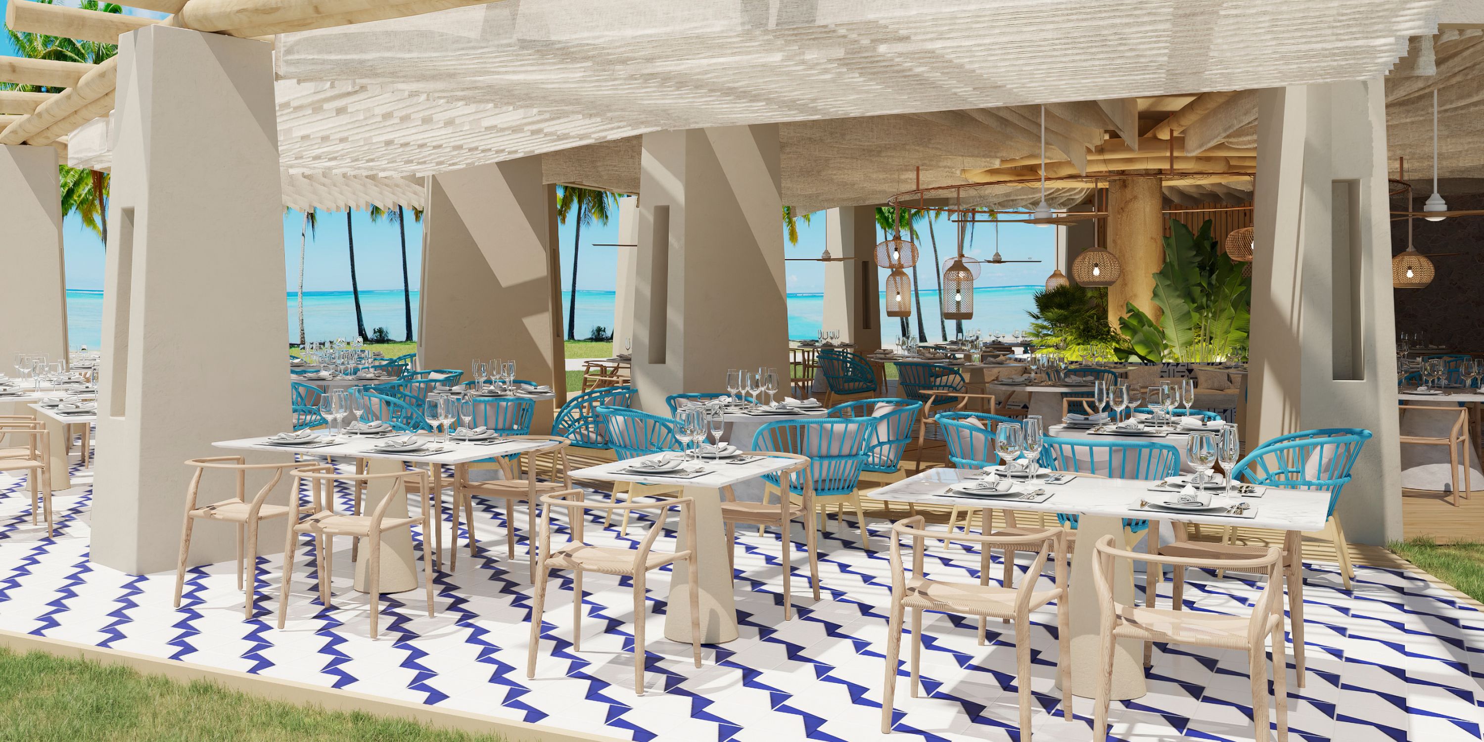 Dreams Playa Esmeralda’s open-air seaside eatery, ideal for destination weddings, has blue chairs and zigzag-patterned floors.