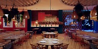 Vibrant Dreams Playa Esmeralda, adorned with woven light fixtures and colorful decor, is the perfect setting for a destination wedding.