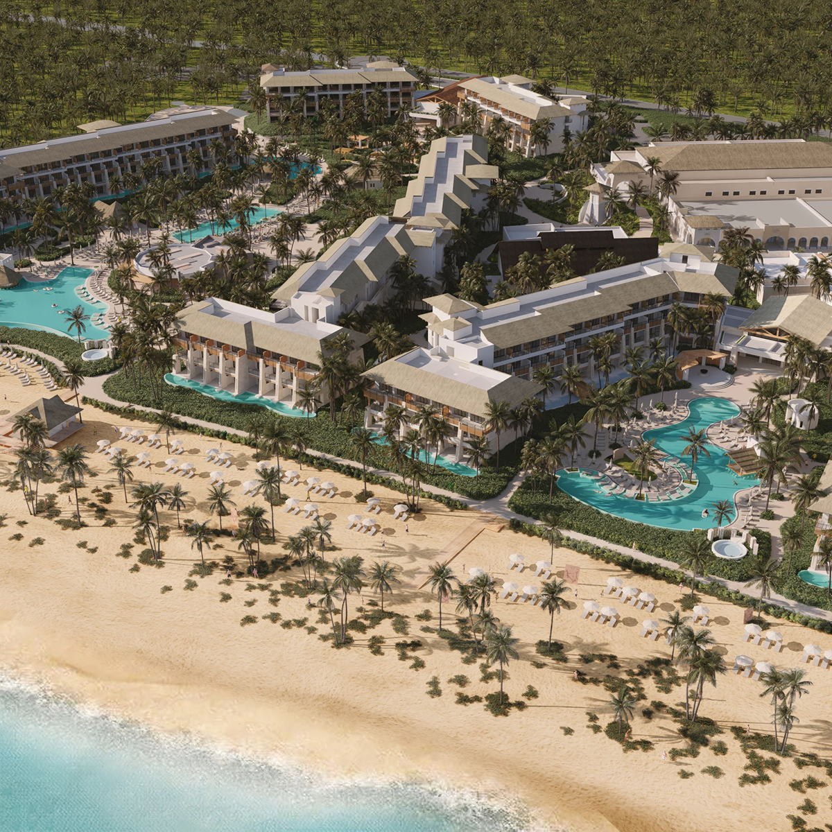 An aerial perspective of the Dreams Playa Esmeralda resort showcases its stunning pools, lush palm trees, and elegant buildings—an enchanting setting perfect for a destination wedding.