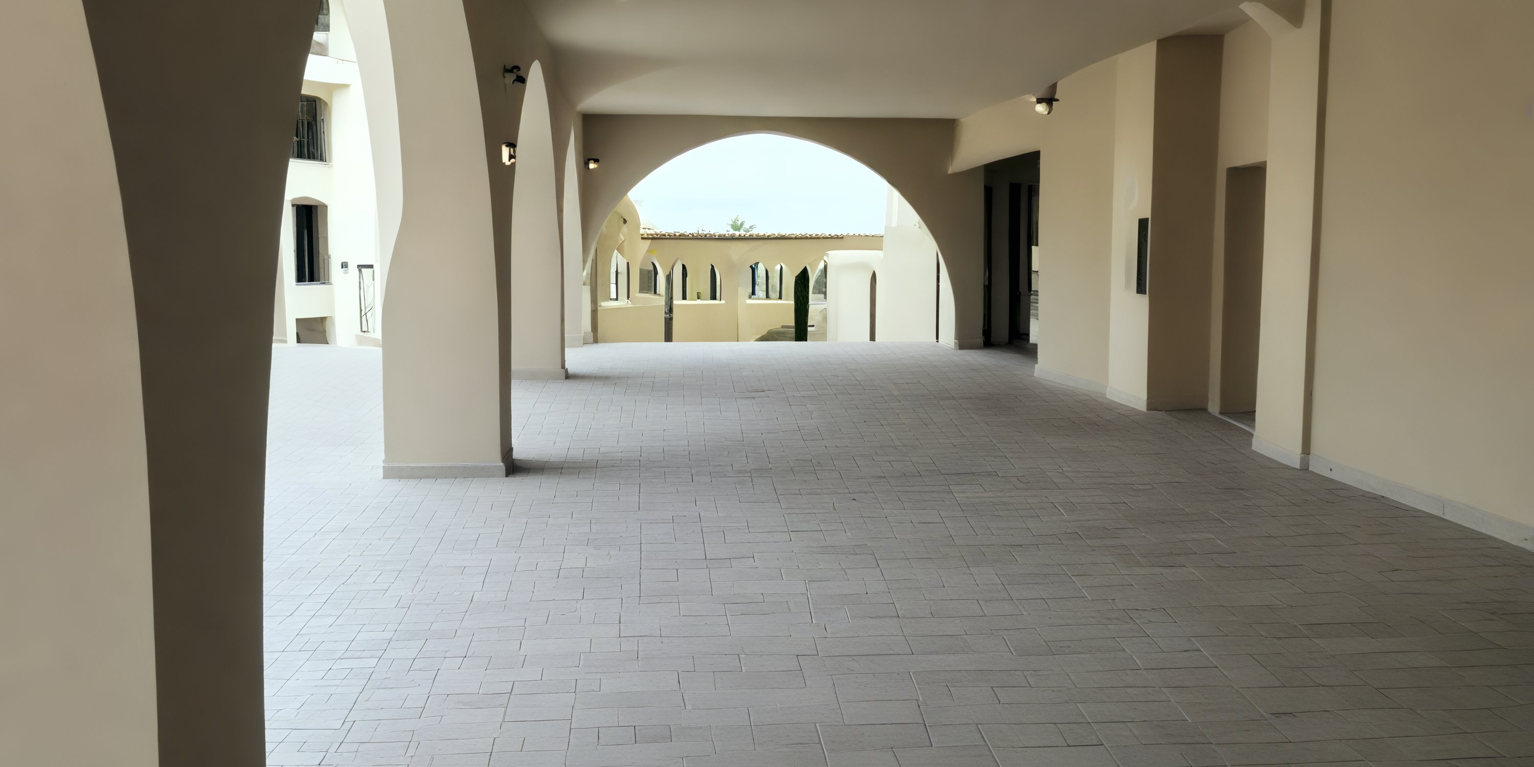 Elegant cream-arched walkway with tiled floor at Dreams Playa Esmeralda, perfect for a destination wedding.