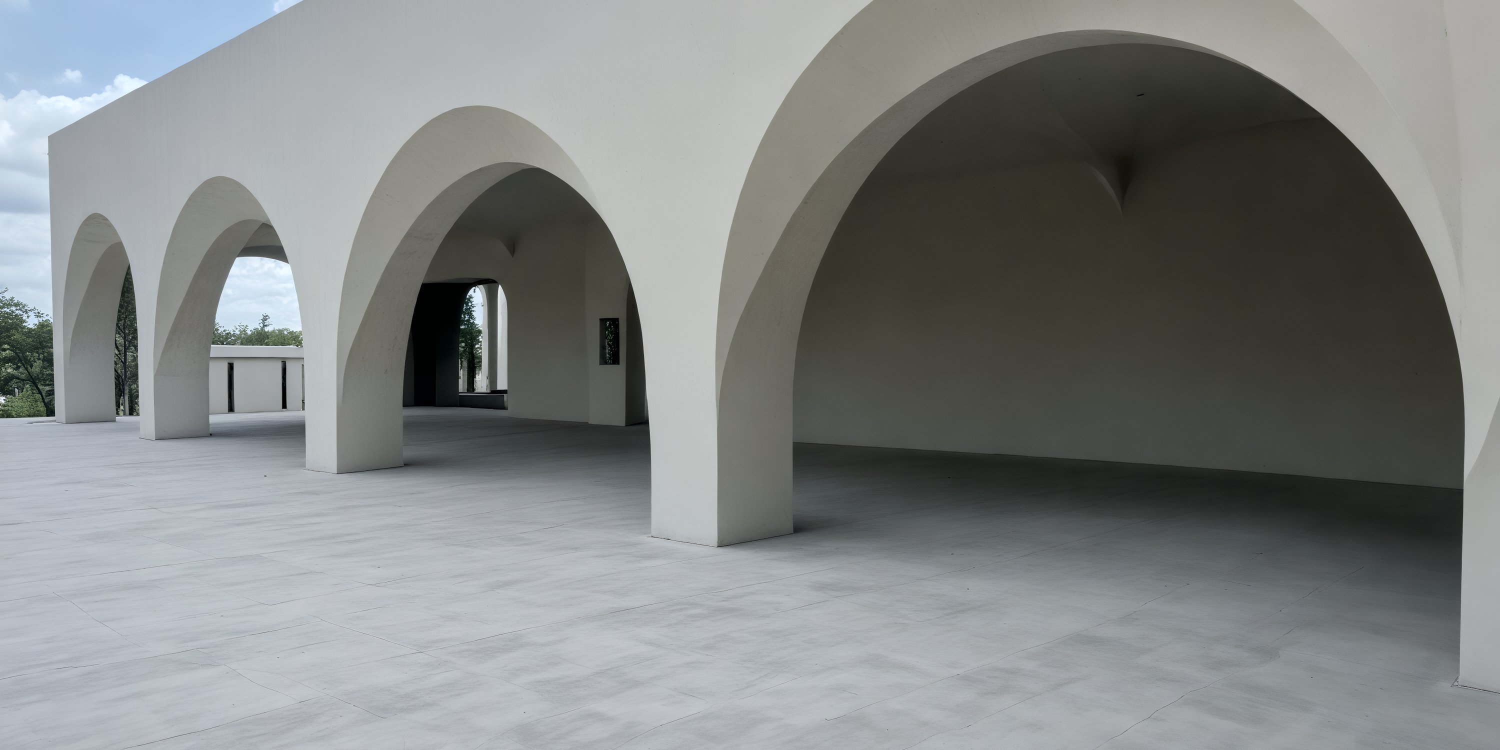 Dreams Playa Esmeralda’s white concrete, open arches, and tiled floors create a stunning wedding venue.
