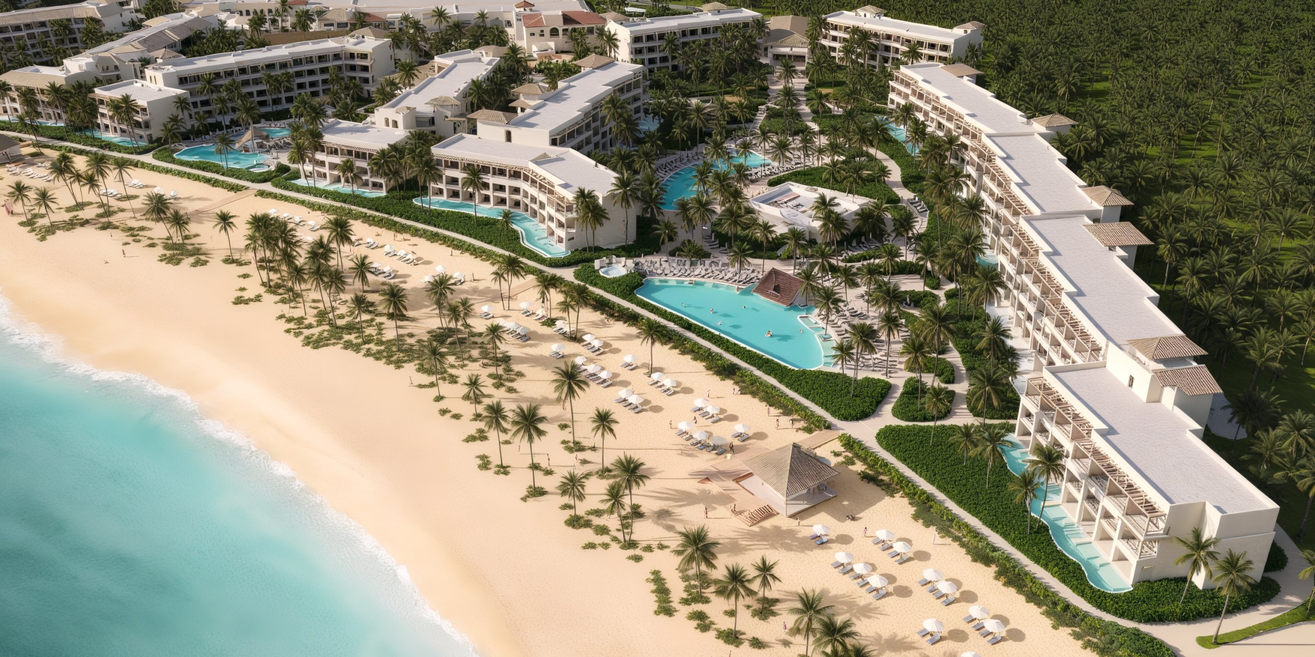 A breathtaking aerial view of Secrets Playa Esmeralda showcases its luxurious pools, lush palm trees, and pristine sandy beach—a perfect setting for a destination wedding.