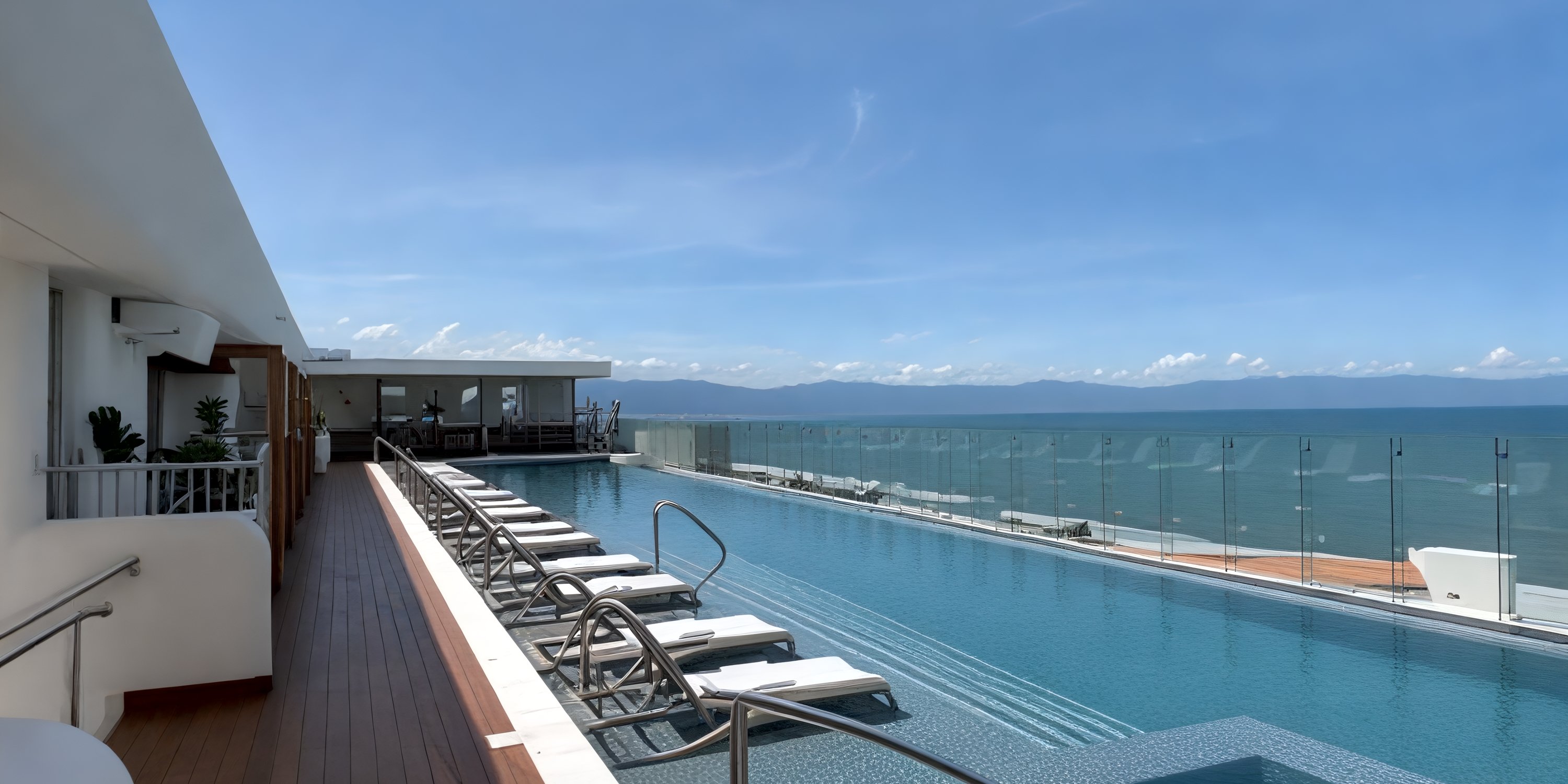 Infinity pool with lounge chairs at UNICO 20°105° Riviera Nayarit, perfect for a destination wedding view.