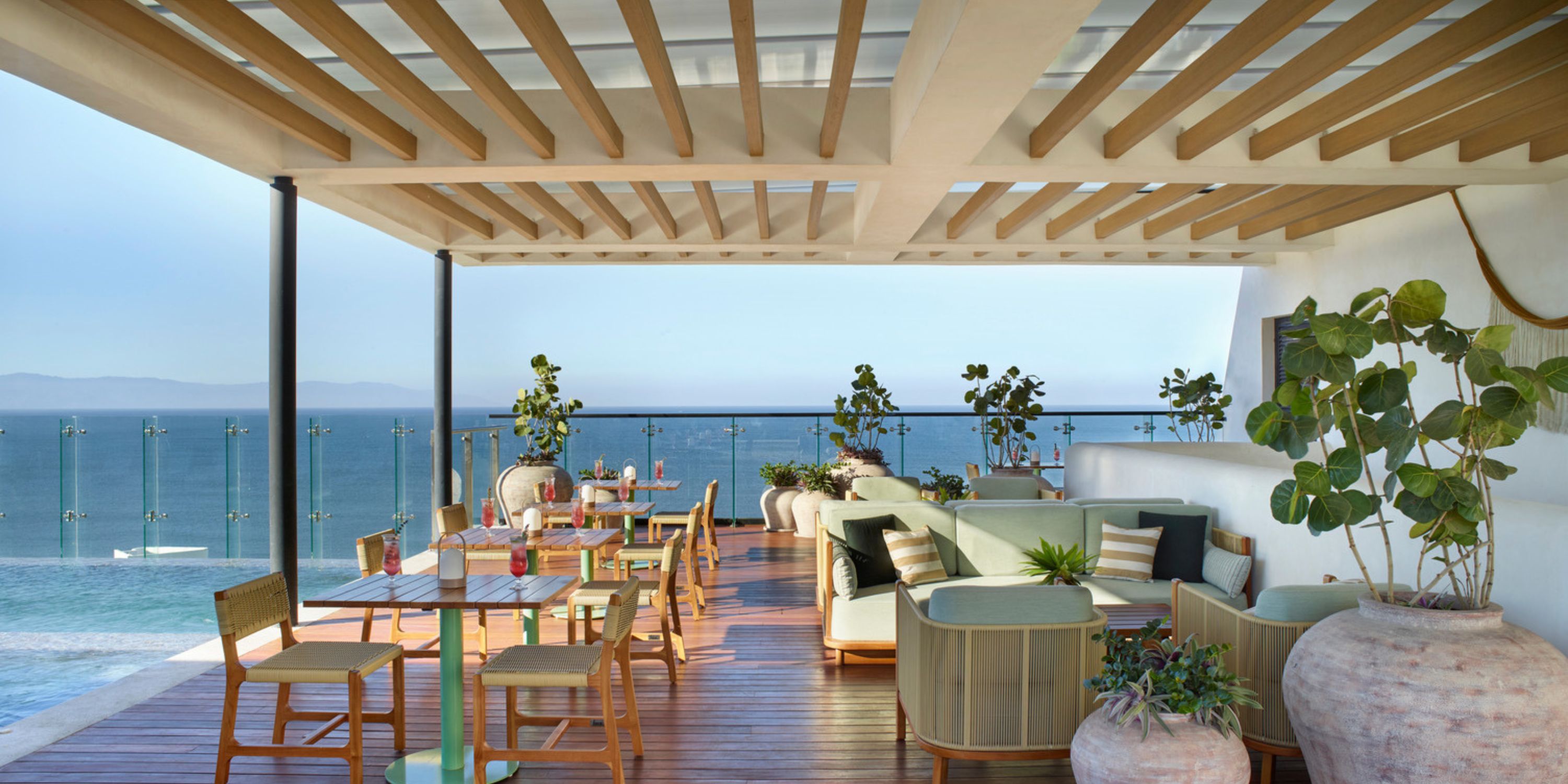 Stylish terrace at UNICO 20&deg;105&deg; Riviera Nayarit set for a destination wedding, with ocean views.
