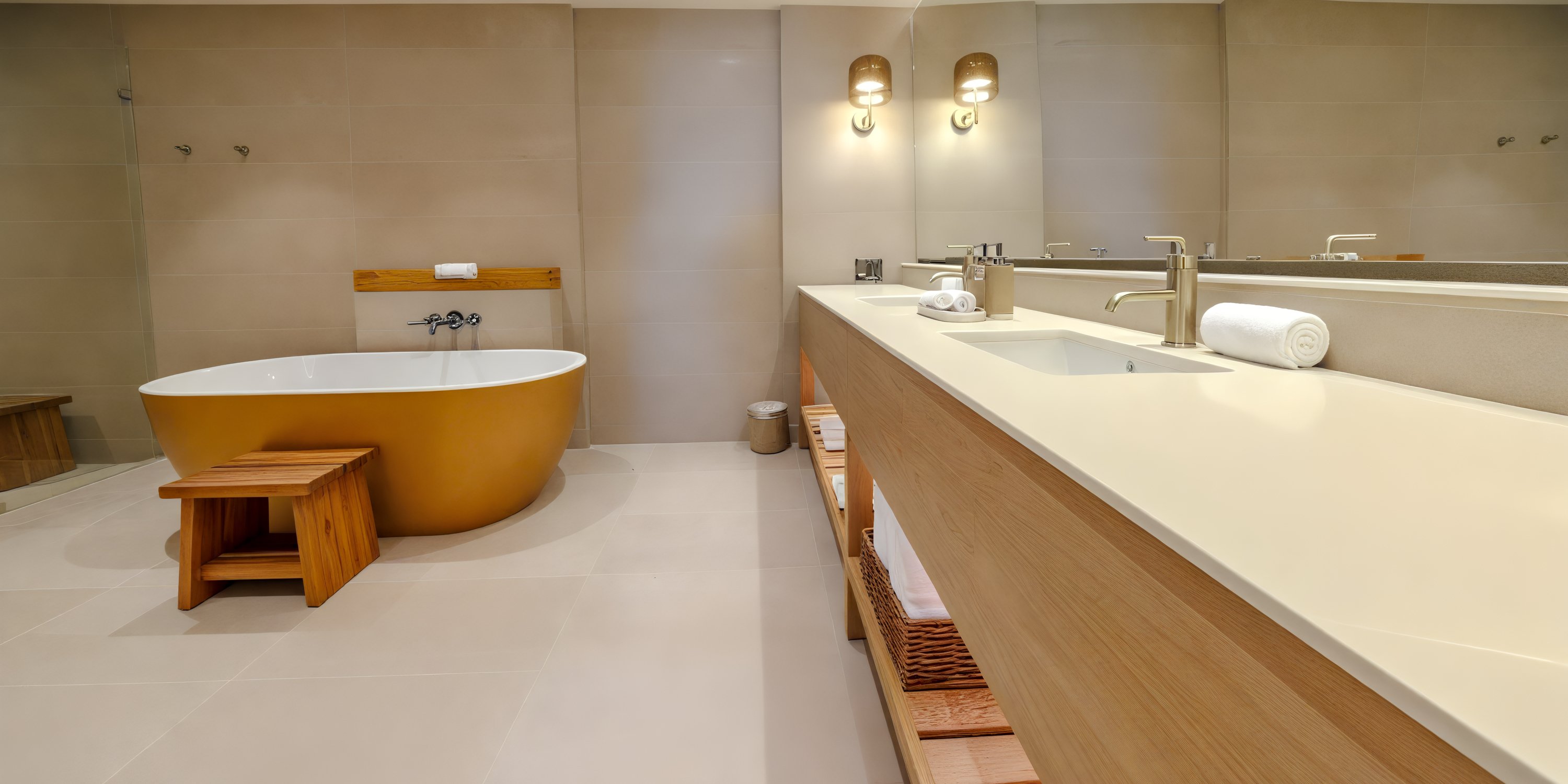 Modern bathroom, ideal for a destination wedding, features UNICO 20°105° tub, stool, double sink, mirror.
