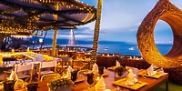UNICO 20°87° provides a stunning rooftop dining experience, perfect for a destination wedding, with breathtaking ocean views and the enchanting glow of warm string lights at dusk.