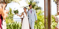 The bride and groom beamed with joy during their outdoor destination wedding ceremony at the tropical UNICO 20°87°.