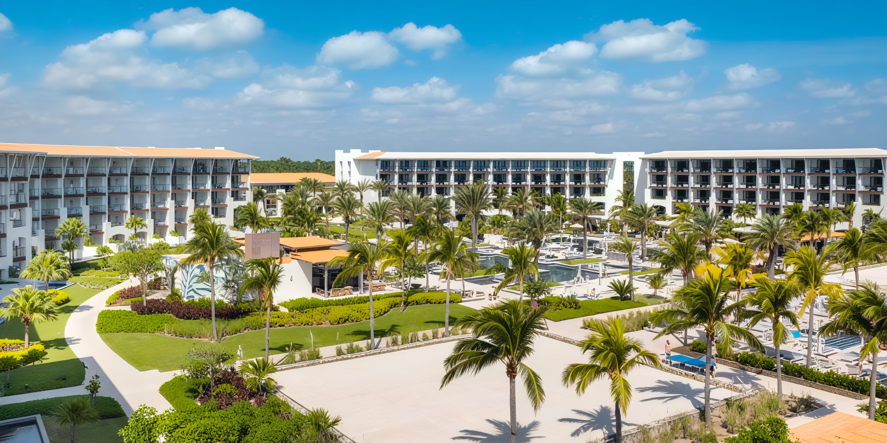 UNICO 20°87° Resort: surrounded by swaying palm trees and a collection of elegant buildings beneath a clear blue sky, it's the ideal setting for a destination wedding.