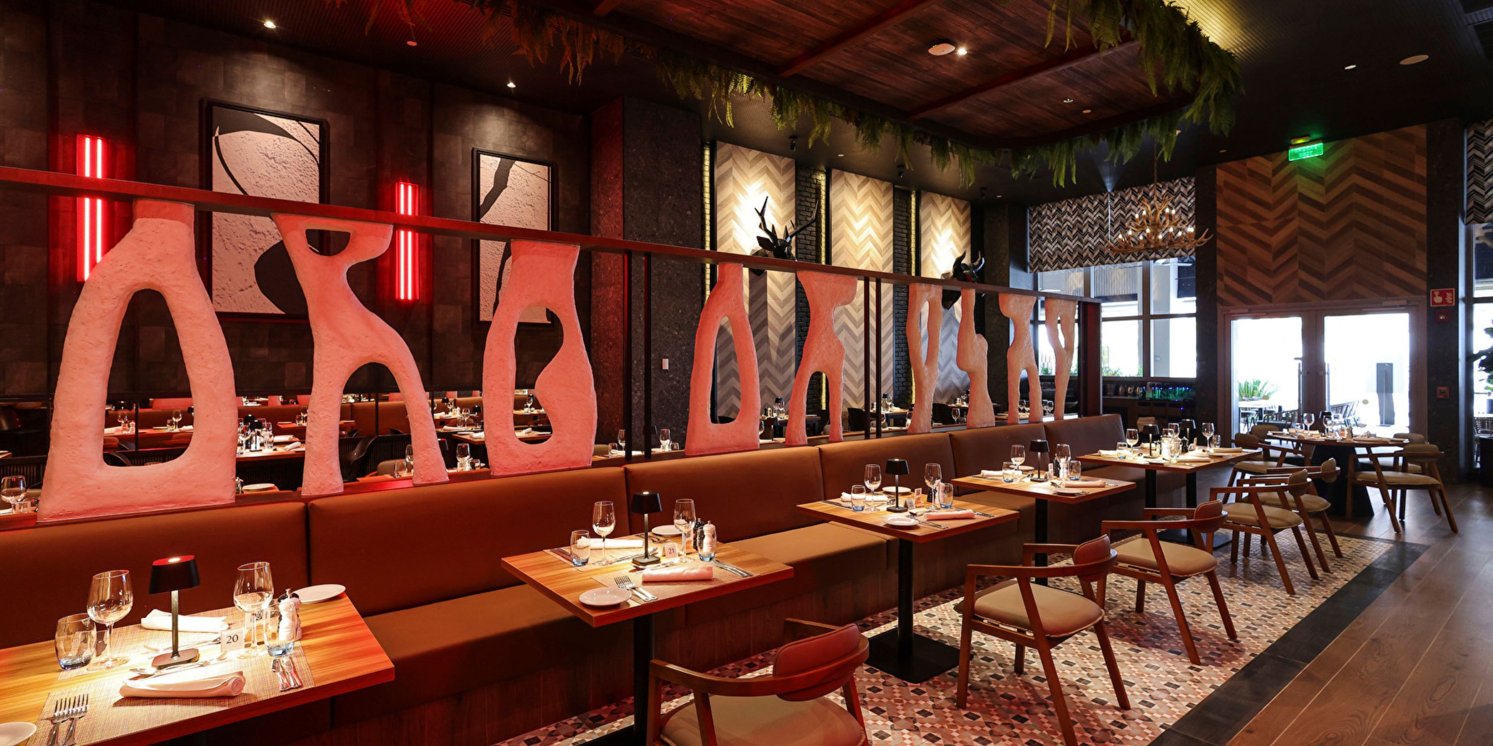 Modern interior at Hotel Riu Ventura, perfect for a destination wedding, with wooden tables and d&eacute;cor.