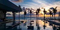 Infinity pool at Hotel Riu Ventura, perfect for a destination wedding, with ocean views and palms.