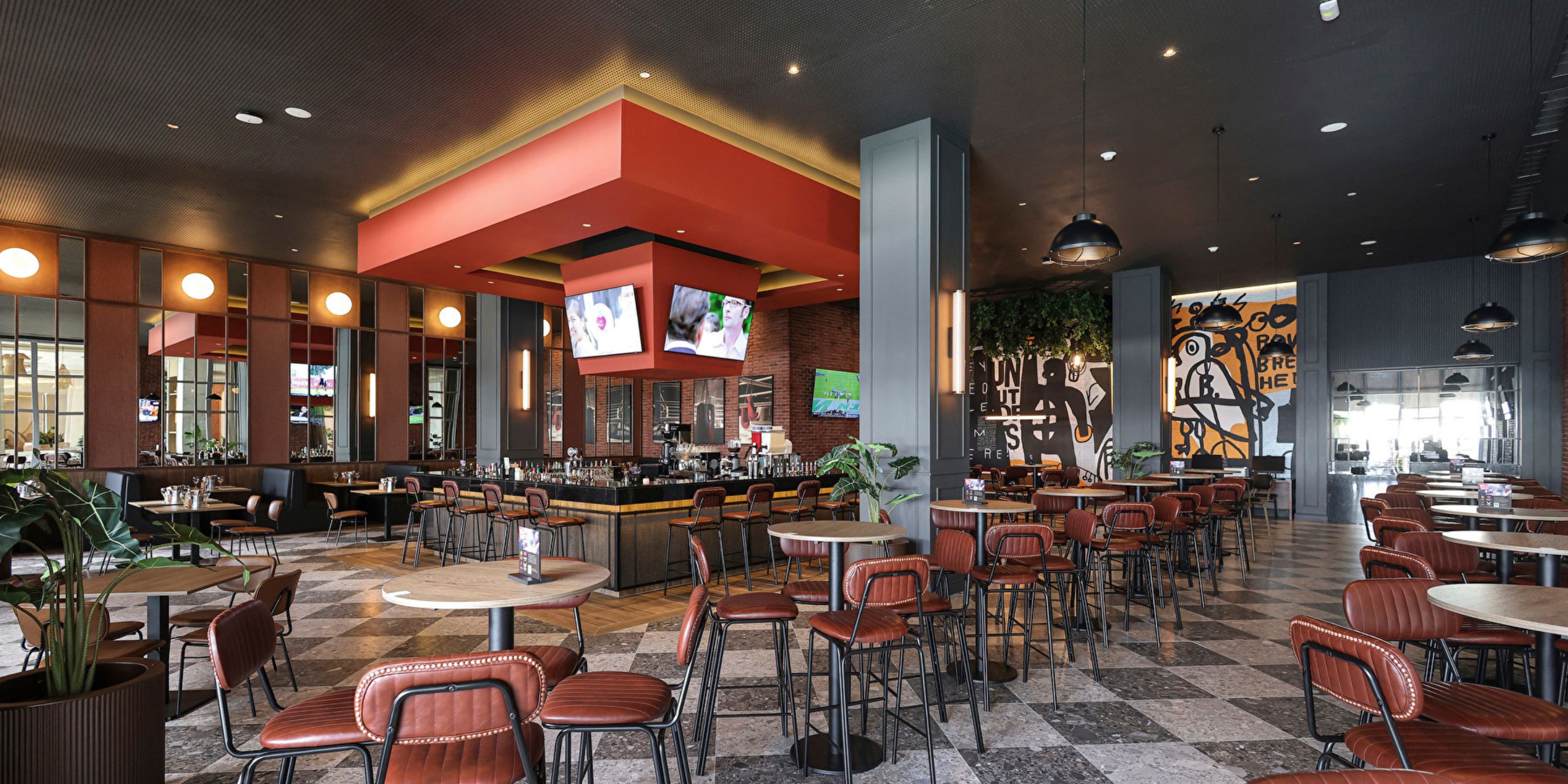 Hotel Riu Ventura&rsquo;s modern interior is perfect for a destination wedding, with brown chairs and a bar.