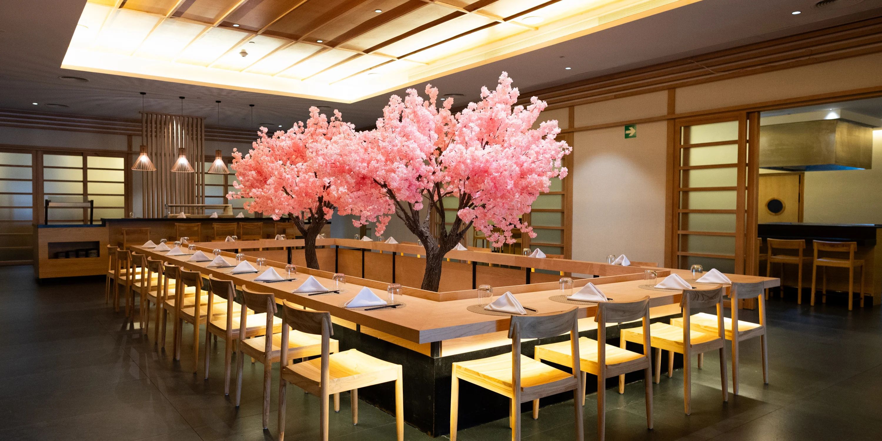 Chic restaurant adorned with cherry blossoms, perfect for a destination wedding at Majestic Mirage Costa Mujeres.