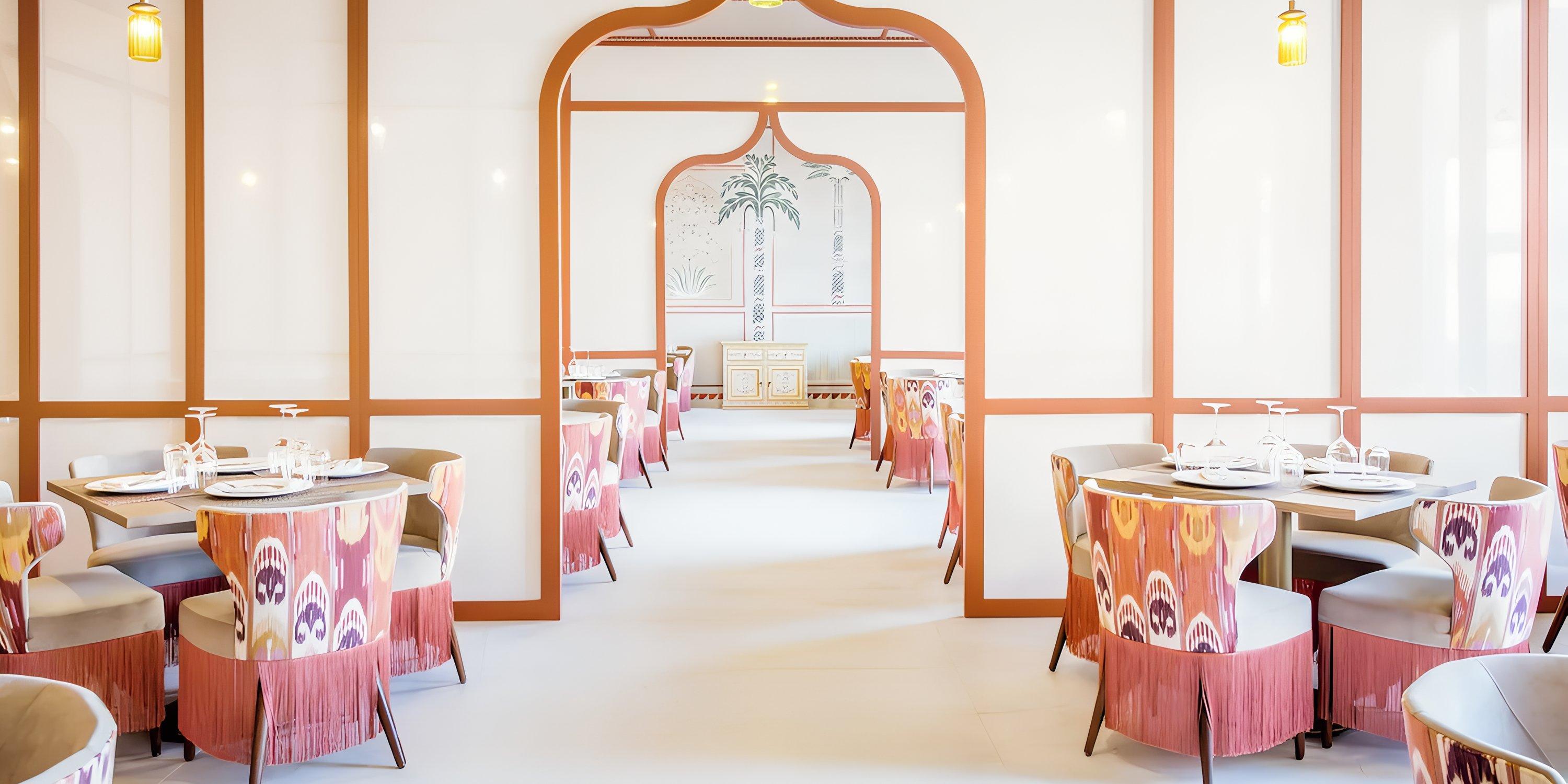 A brightly lit restaurant with patterned chairs, ideal for a destination wedding at Majestic Mirage Costa Mujeres.