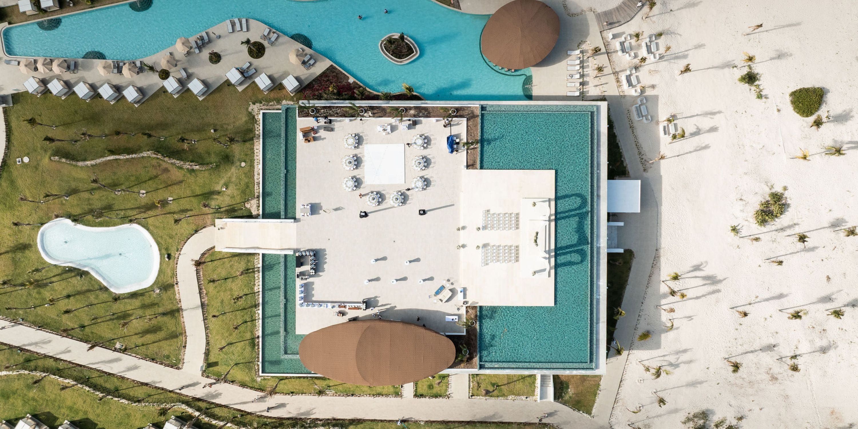 Aerial view of Majestic Mirage Costa Mujeres resort, ideal for a destination wedding with pools and lounges.