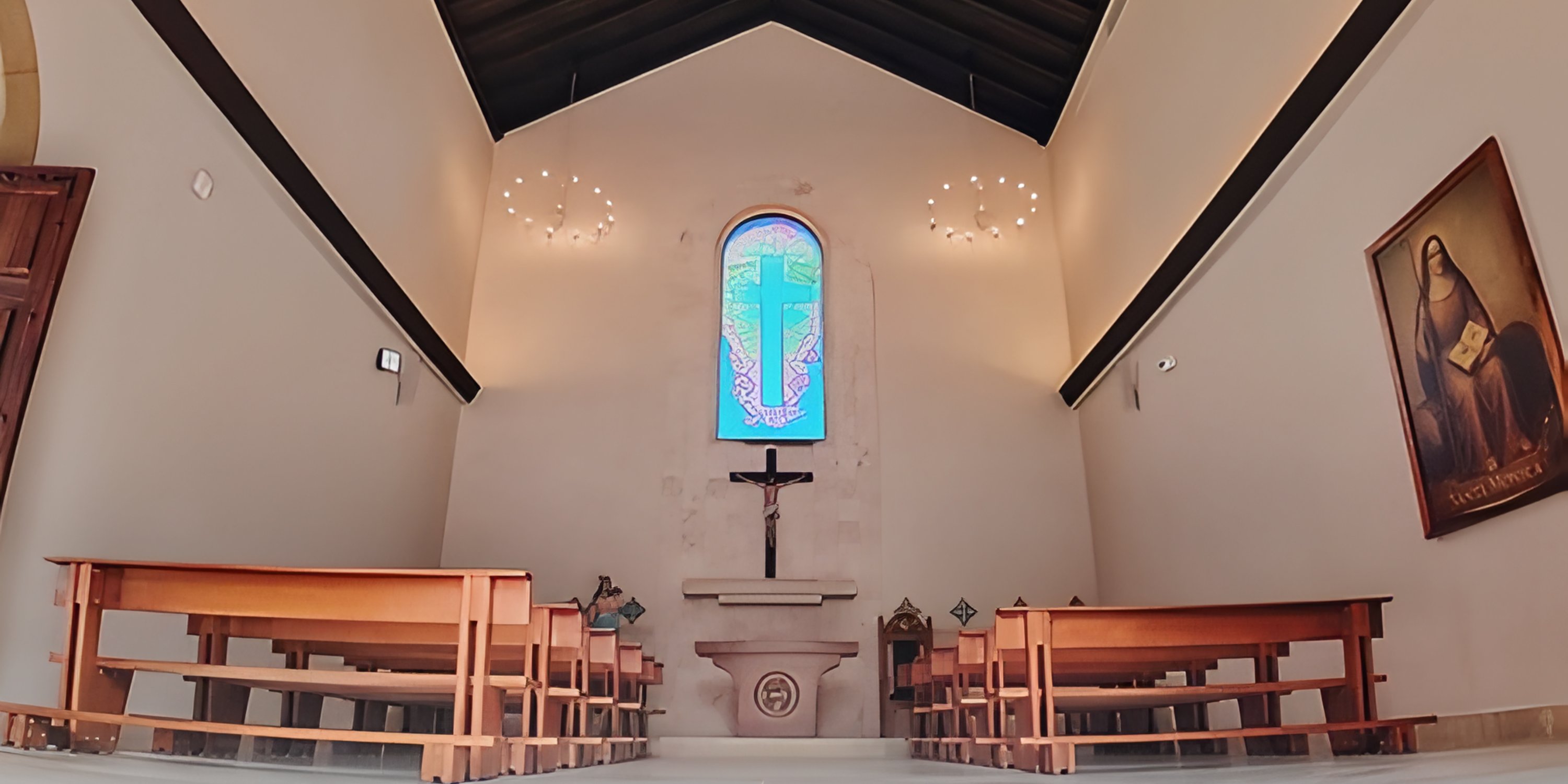 A wedding chapel with a cross and benches, ideal for destination weddings at Majestic Mirage Costa Mujeres.