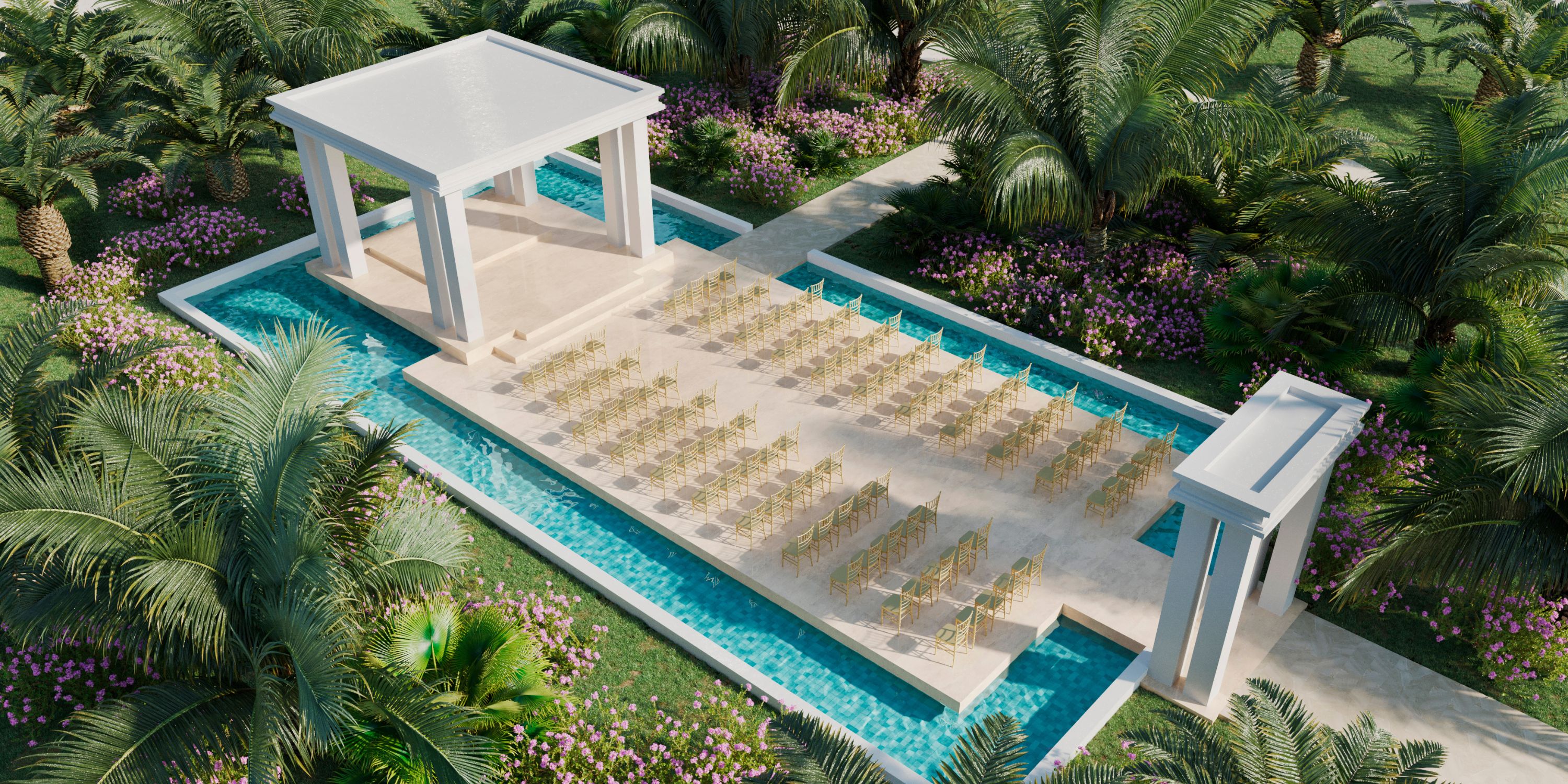 Destination wedding venue at Majestic Mirage with white columns, palm trees, and water in the background.