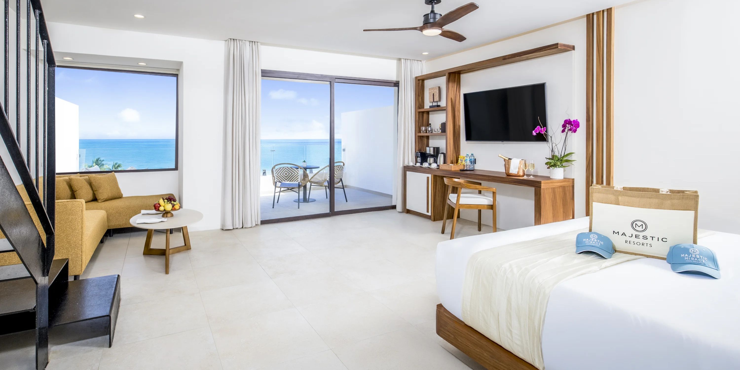Modern suite with ocean view balcony, perfect for a destination wedding at Majestic Mirage Costa Mujeres.