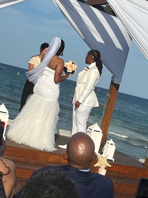 Grace and Mohammed exchange vows in a beautiful seaside ceremony during their destination wedding.