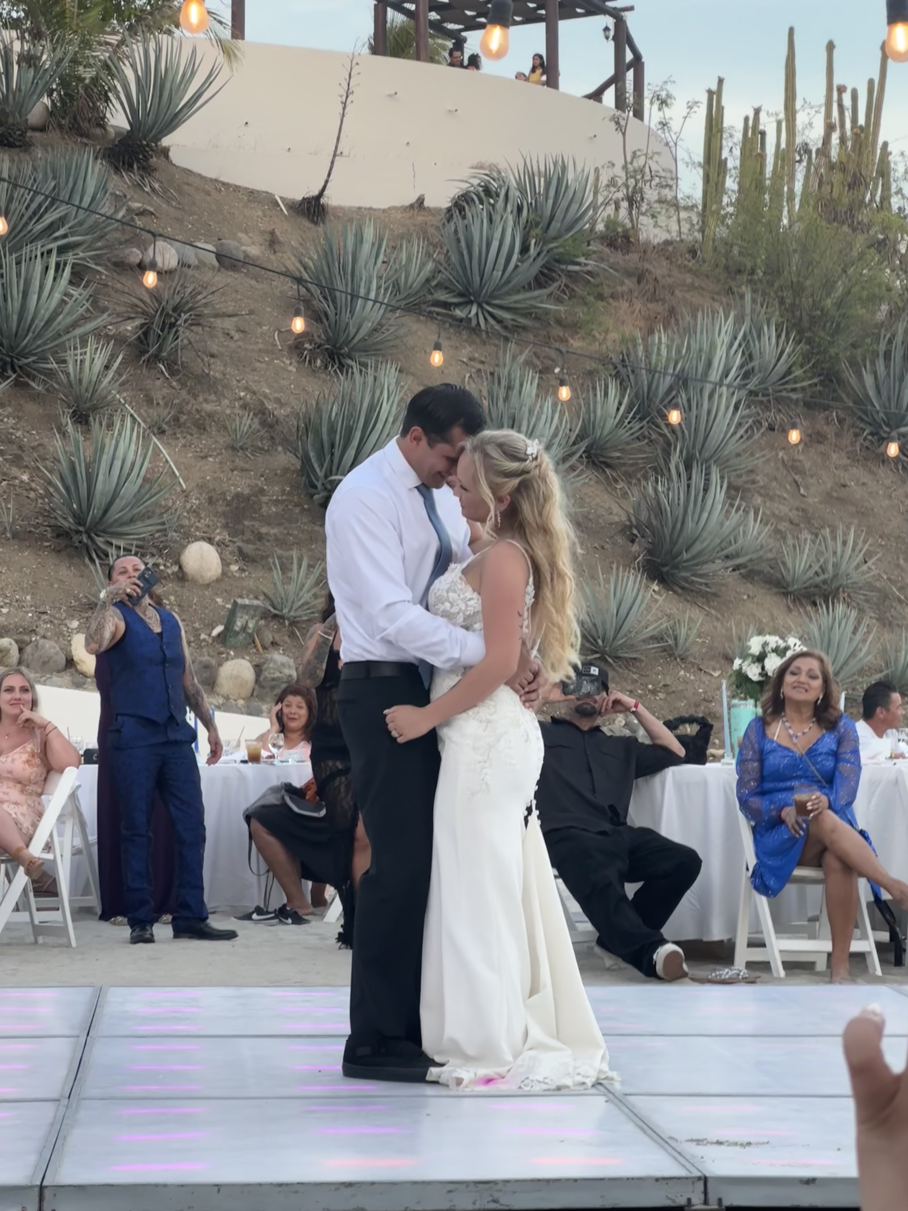 Camille and Jeff share their first dance at their beautiful outdoor destination wedding reception.