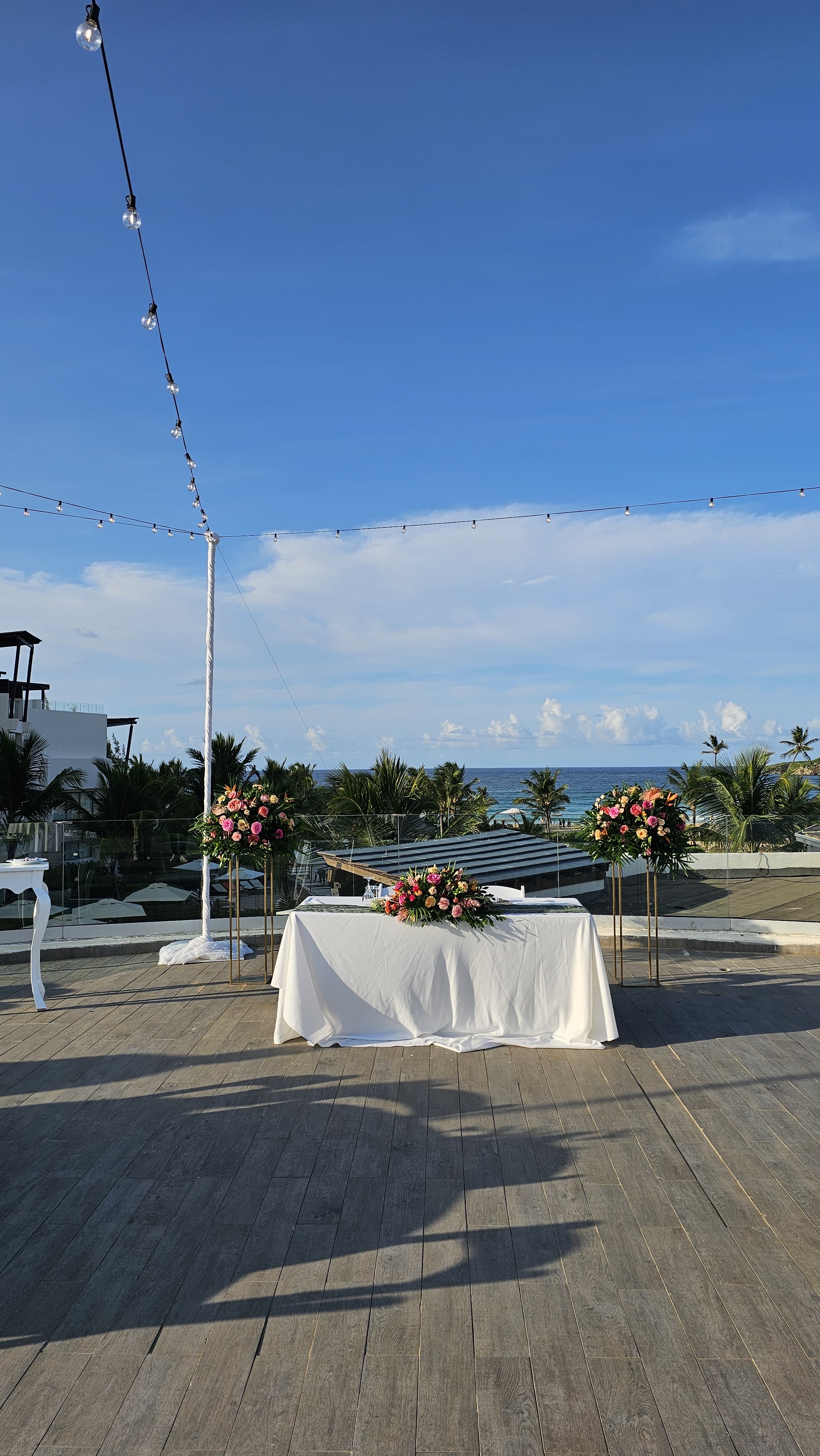 Tiana and Steven’s destination wedding featured an outdoor celebration with elegant white tables, beautiful florals, and romantic string lights.