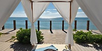Ocean Coral and Turquesa offers a romantic cabana with flowing white curtains, overlooking the ocean and sky—an idyllic setting for your destination wedding.
