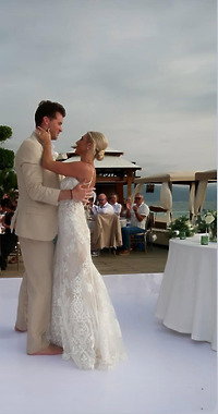 Leah and Christopher enjoy their first dance together at their outdoor destination wedding reception.