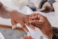 At the destination wedding ceremony, a Jordan and Kievan ring is placed on someone's finger.