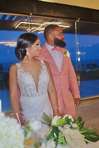 Sydney and Hayden (Copy) stand together at the destination wedding reception.