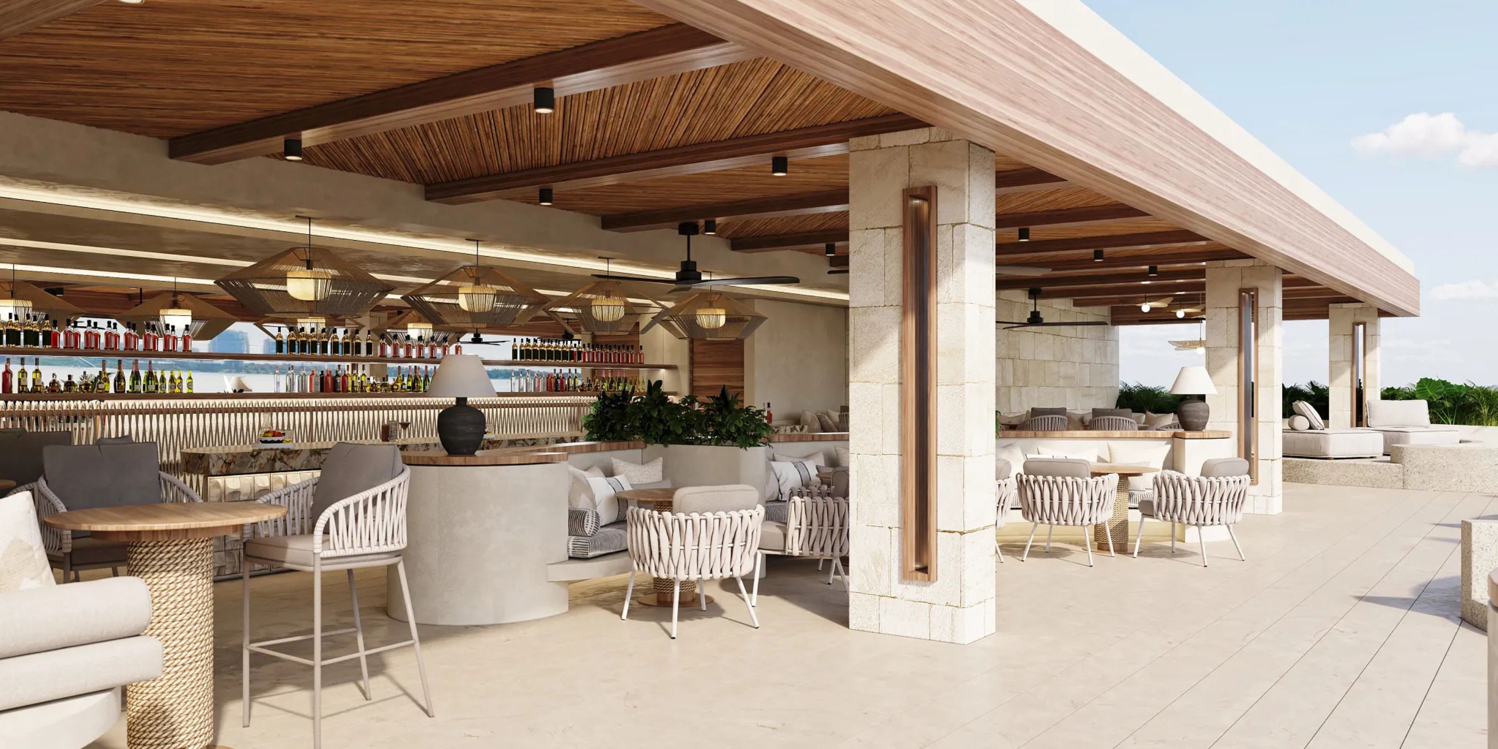 Modern outdoor restaurant at Secrets Mirabel Cancun Resort & Spa, perfect for destination weddings, with bar and wicker chairs.