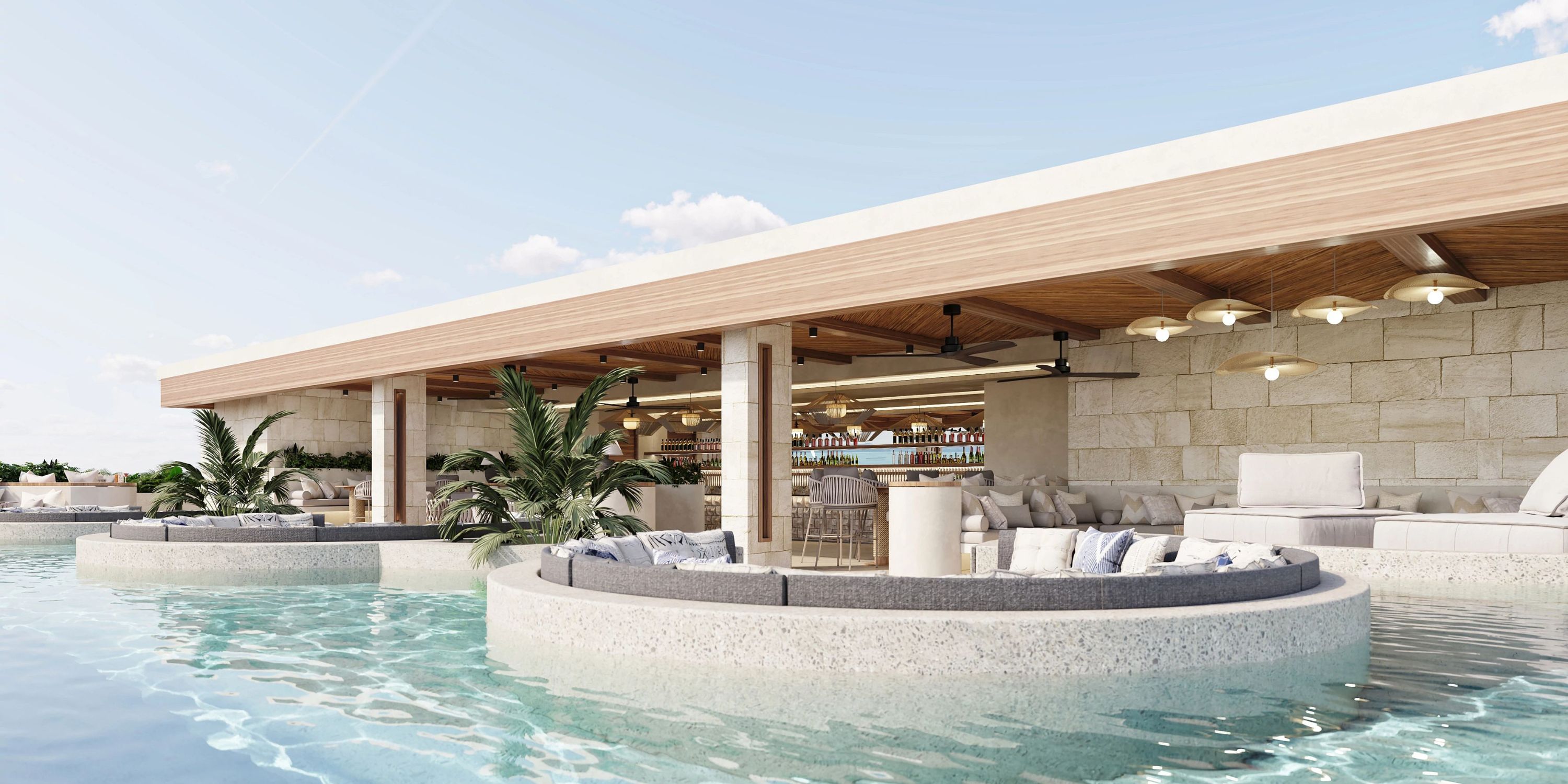 Modern poolside lounge and bar, perfect for a destination wedding, with circular seating over blue water.