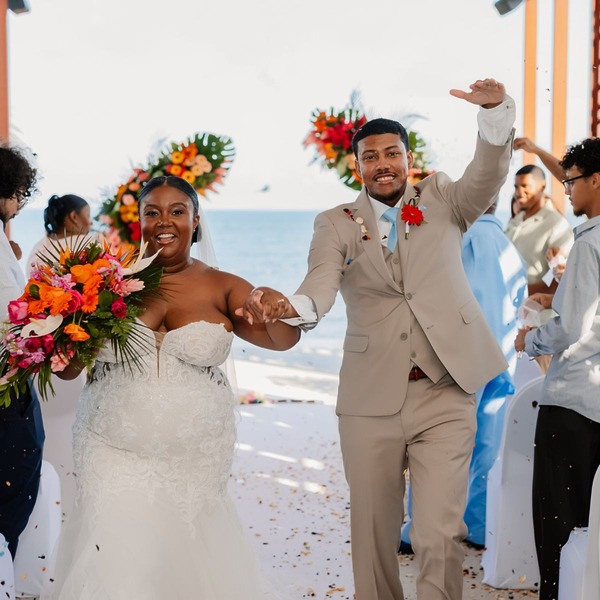 Jessie and Taylor (Copy) joyfully walk down the aisle at their beautiful seaside destination wedding.