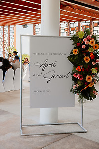 Destination wedding welcome sign for Jessie and Taylor, adorned with flowers, August 1, 2025.